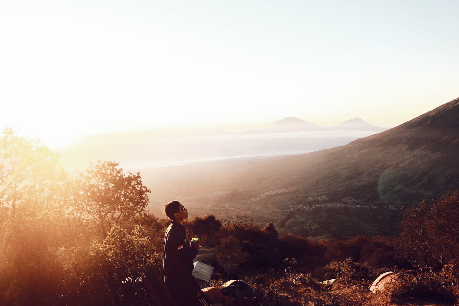 man standing on hill