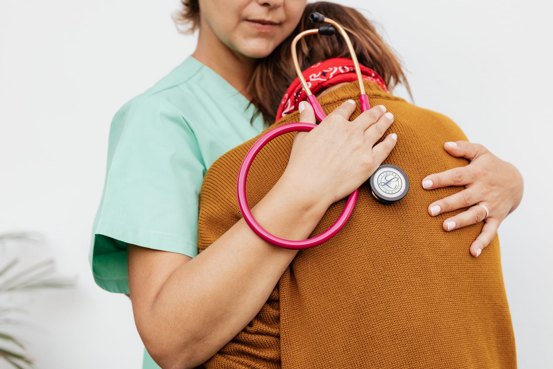 a doctor consoling a person