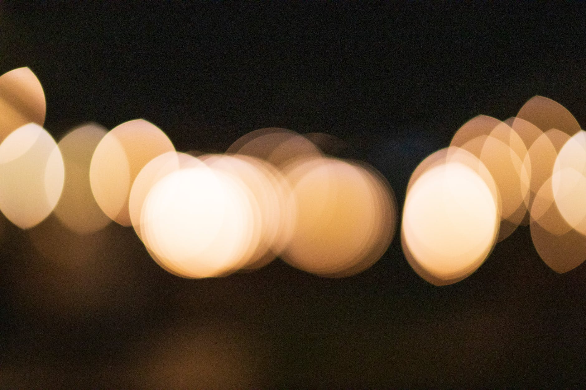 abstract bokeh background of multiplying lights at dusk