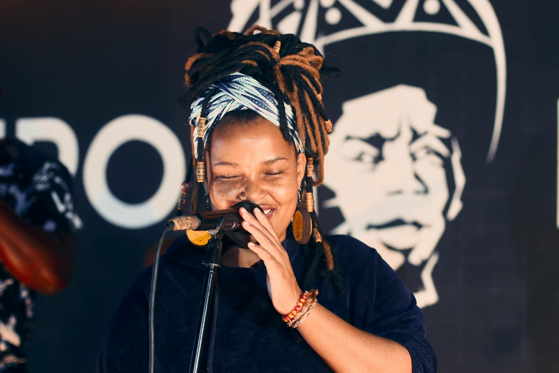 photo of woman singing