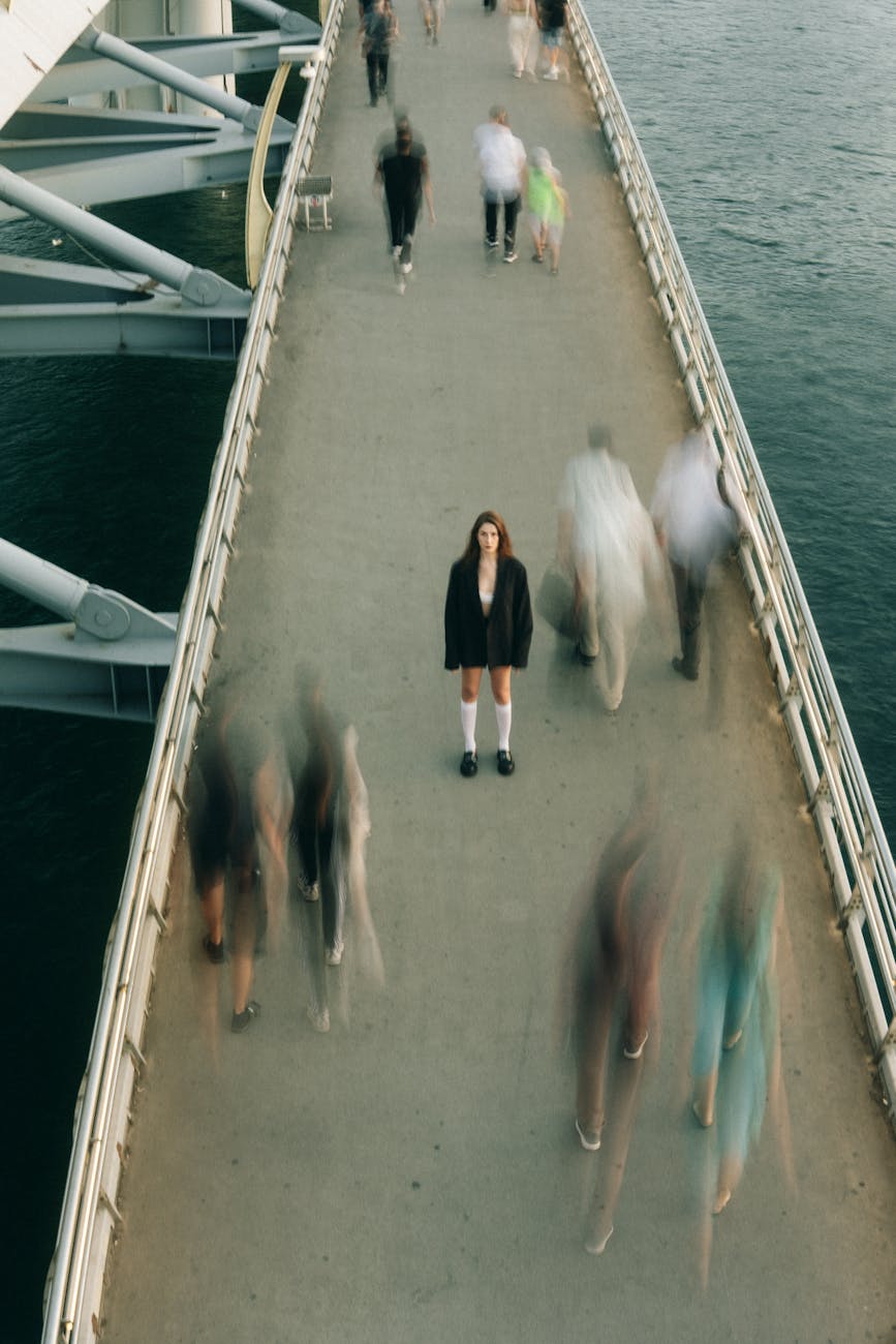 woman standing on footbridge