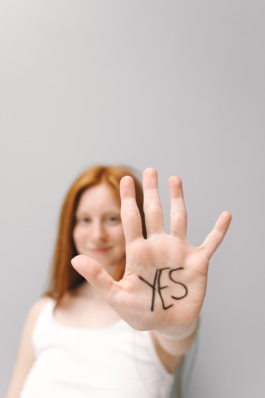 woman s with yes word on her hand