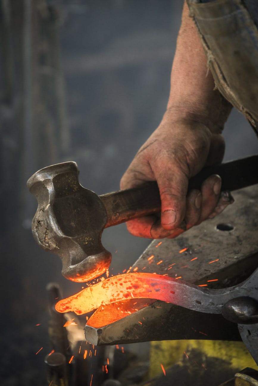 man forging metal
