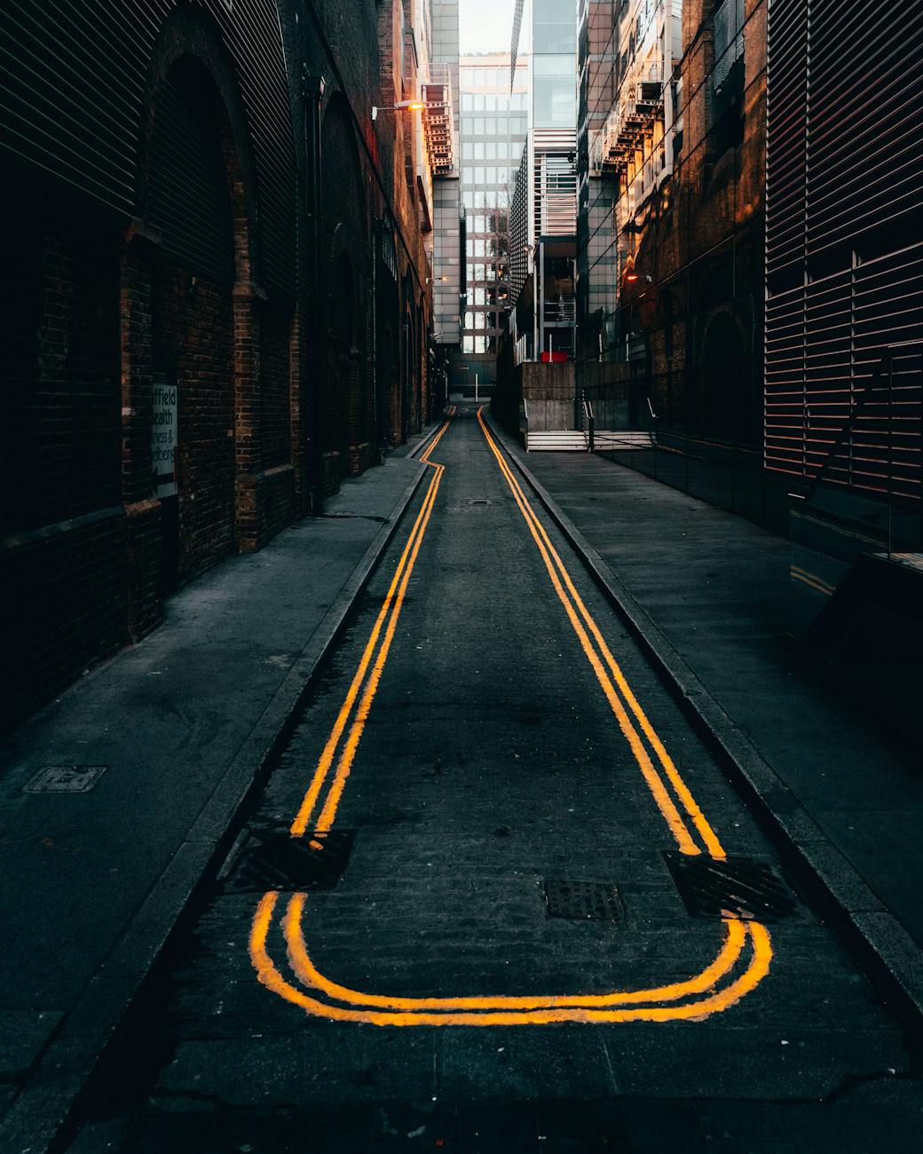photo of empty alley in between buildings