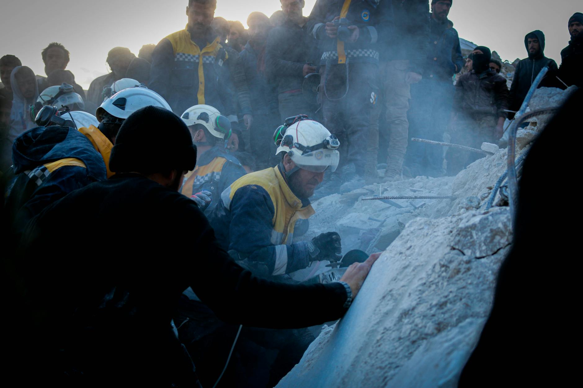 rescuers clearing the rubble