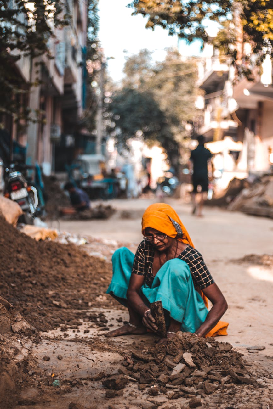 woman holding brown rock